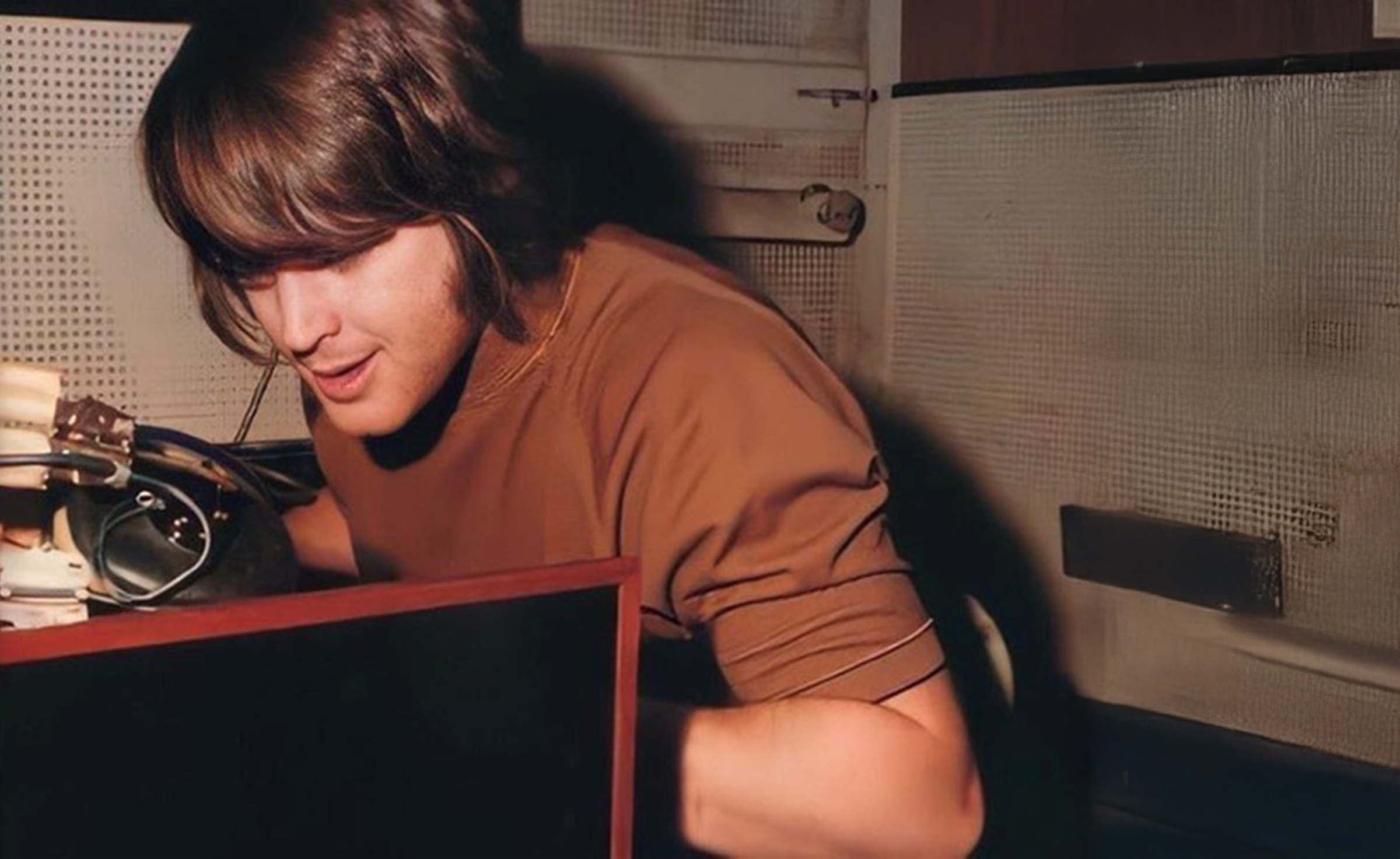 Brain Wilson playing piano in a recording studio