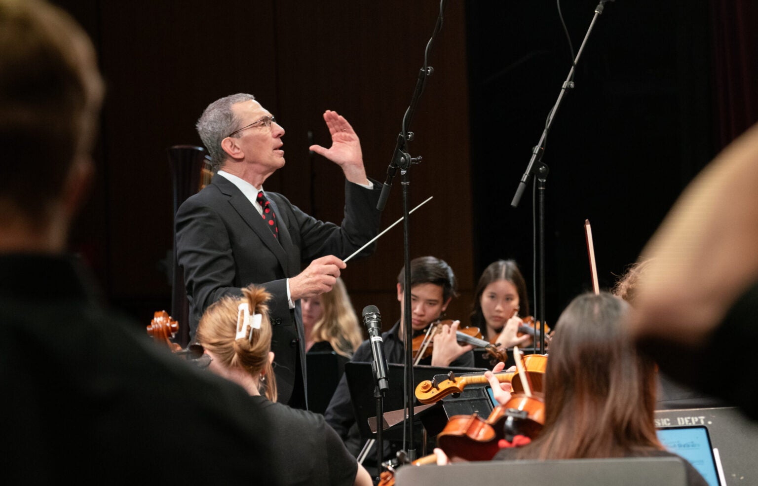 Conductor conducting orchestra