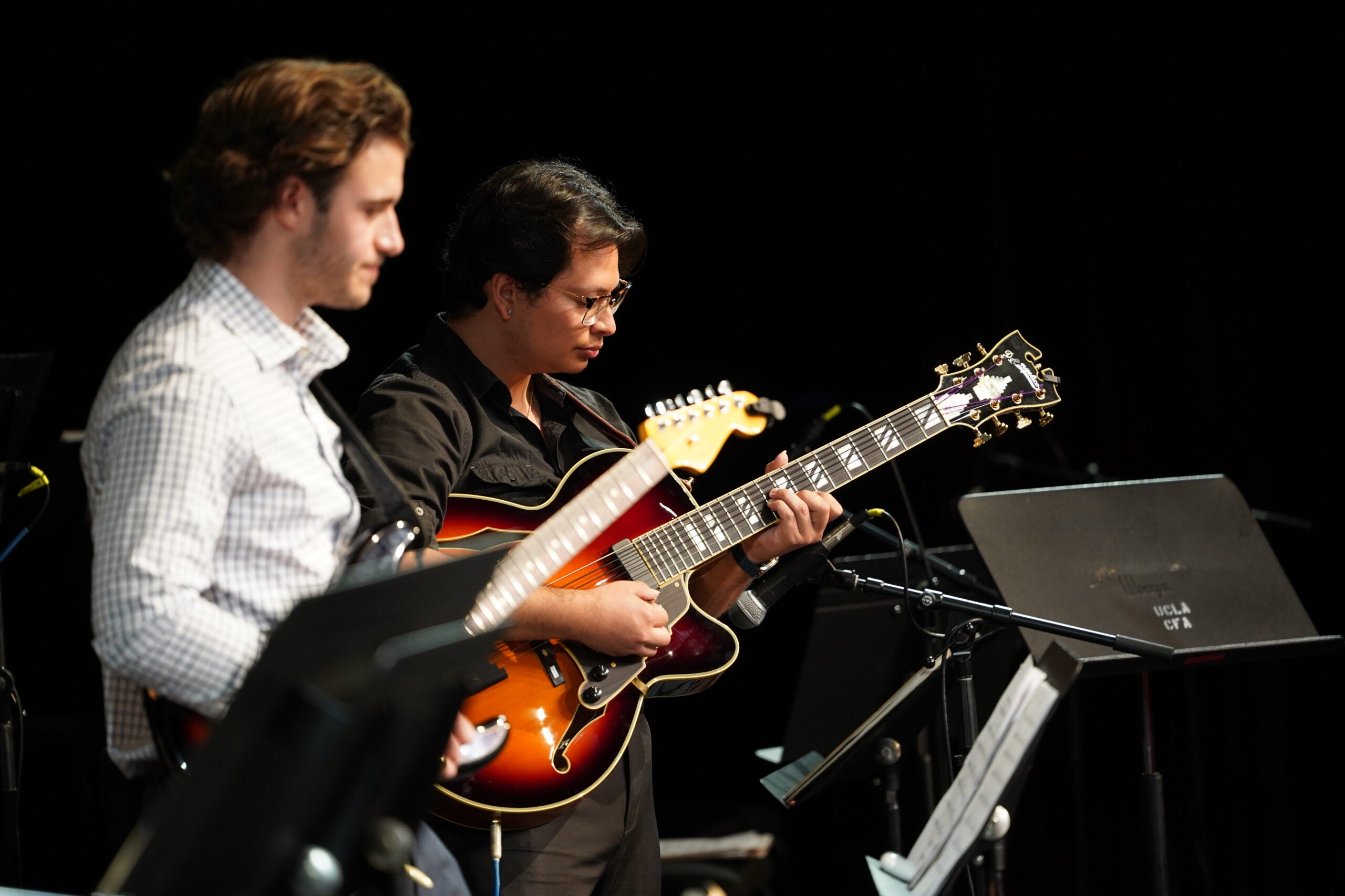 two jazz guitarists on stage