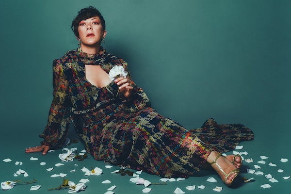 Gretchen Parlato posing on the floor. 